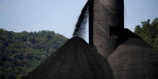 Coal spills out from a tower into a large pile at an Alpha Natural Resources Inc. coal preparation plant in Logan County near Yolyn, West Virginia, U.S., on Wednesday, Aug. 5, 2015. Alpha Natural Resources Inc. filed for bankruptcy in Virginia last week, becoming the latest victim of the coal industrys worst downturn in decades. Photographer: Luke Sharrett/Bloomberg via Getty Images