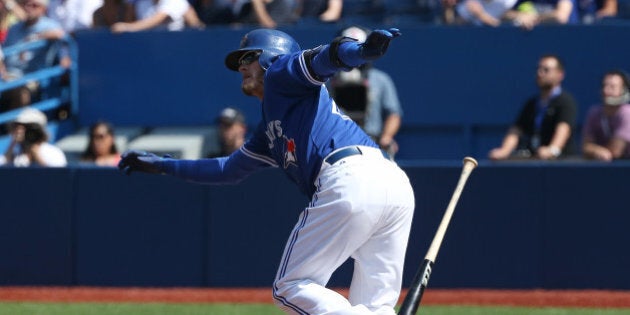 TORONTO, CANADA - SEPTEMBER 6: Josh Donaldson #20 of the Toronto Blue Jays hits an RBI double in the first inning during MLB game action against the Baltimore Orioles on September 6, 2015 at Rogers Centre in Toronto, Ontario, Canada. (Photo by Tom Szczerbowski/Getty Images)