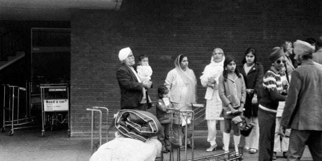 Ugandan Asian refugees arrive at Heathrow Airport after their expulsion from Uganda under the regime of Idi Amin, 1972. (Photo by Charlie Phillips/Getty Images)