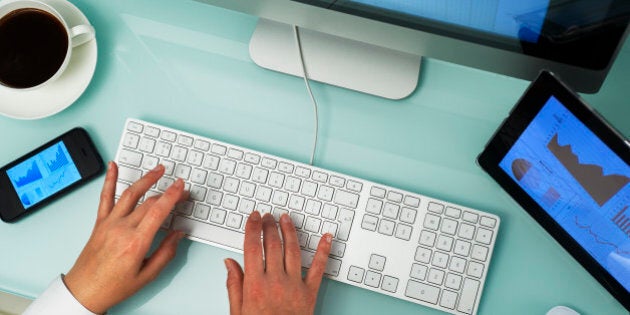 Overhead of workplace with multiple digital devices