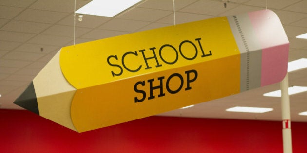 Signs advertising back to school shopping are displayed at a Target Corp. store in Colma, California, U.S., on Saturday, Aug. 9, 2014. Retailers are pushing for a longer shopping season and earlier than ever deals on order to get customers to buy more over a longer period of time, says DealNews spokesman Mark LoCastro, which tracks price and discount trends across the web, according to USA Today. Photographer: David Paul Morris/Bloomberg via Getty Images