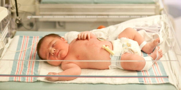 New Born baby boy in hospital nursery