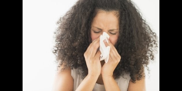 USA, New Jersey, Jersey City, Woman blowing nose