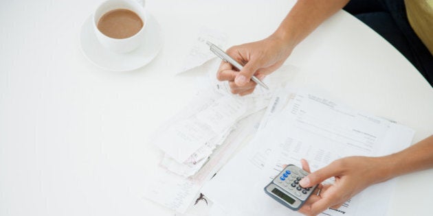 Woman at table paying bills