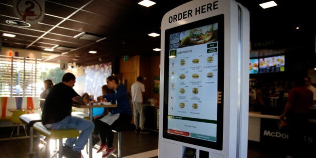 A self-service card payment touch screen panel displays sandwich options inside a McDonald's Corp. restaurant in Manchester, U.K., on Monday, Aug. 10, 2015. McDonald's Chief Executive Officer Steve Easterbrook predicted a return to growth for the burger chain in the second half of the year, giving investors cause for optimism after another quarter of slumping sales. Photographer: Paul Thomas/Bloomberg via Getty Images