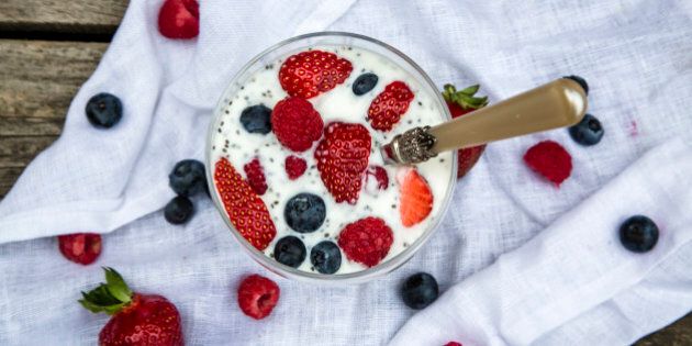 Natural yoghurt with chia seeds and fruits in glass