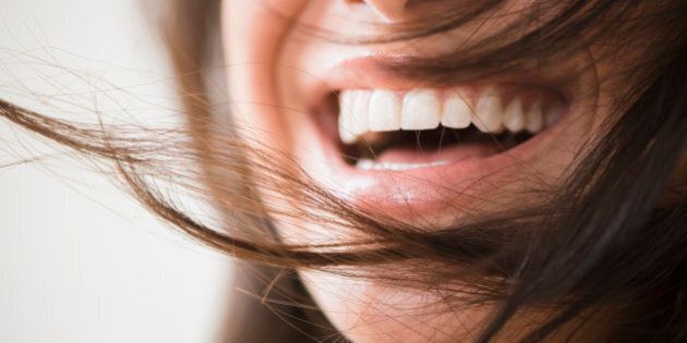 Close up of laughing woman with messy hair