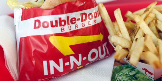 A Double-Double burger and french fries are arranged for a photograph at an In-N-Out Burger restaurant in Costa Mesa, California, U.S., on Wednesday, Feb. 6, 2013. In-N-Out, with almost 280 units in five states, is valued at about $1.1 billion based on the average price-to-earnings, according to the Bloomberg Billionaires Index. Photographer: Patrick T. Fallon/Bloomberg via Getty Images