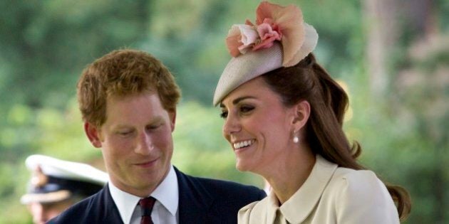 Britain's Prince Harry, left, speaks with Kate, the Duchess of Cambridge as they arrive for a commemoration ceremony to mark the 100th anniversary of the outbreak of World War I at the St. Symphorien Cemetery in St. Symphorien, Belgium on Monday, Aug. 4, 2014. The cemetery was established by the German Army as a final resting place for British and German soldiers killed at the Battle of Mons. Among those buried is Pvt. John Parr of the Middlesex Regiment, the first British soldier to be killed in action on the Western Front. (AP Photo/Virginia Mayo)