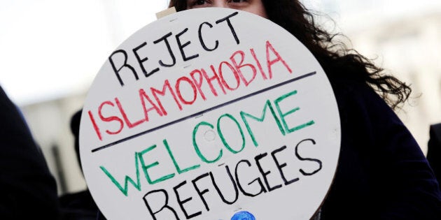 A proponent of the anti-Islamophobia federal government motion M-103, listens to speeches during a rally at City Hall in Winnipeg, Manitoba, Canada March 4, 2017. REUTERS/Lyle Stafford