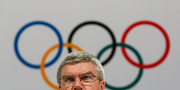 International Olympic Committee President Thomas Bach speaks at a press conference after the 128th IOC session in Kuala Lumpur, Malaysia Monday, Aug. 3, 2015. Bach says the Olympic body will take action against any Olympic medalists if they are found guilty of the latest doping allegations in track and field. (AP Photo/Joshua Paul)