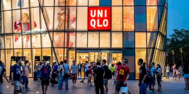 BEIJING, CHINA - JULY 15: (CHINA OUT) People walk by a Uniqlo outlet at Sanlitun after a sex video taken in what appears to be a Uniqlo store fitting room spread online on July 15, 2015 in Beijing, China. The video shot by a smartphone showed a young couple having sex in what appears to be a Uniqlo store fitting room. The Cyberspace Administration of China urged Sina and Tencent to increase their awareness of social responsibility, strengthen management and cooperate with the authority in investigating the case. (Photo by ChinaFotoPress/ChinaFotoPress via Getty Images)
