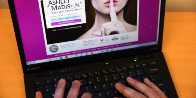 LONDON, ENGLAND - AUGUST 19: In this photo illustration, a man visits the Ashley Madison website on August 19, 2015 in London, England. Hackers who stole customer information from the cheating site AshleyMadison.com dumped 9.7 gigabytes of data to the dark web on Tuesday fulfilling a threat to release sensitive information including account details, log-ins and credit card details, if Avid Life Media, the owner of the website didn't take Ashley Madison.com offline permanently. (Photo illustration by Carl Court/Getty Images)