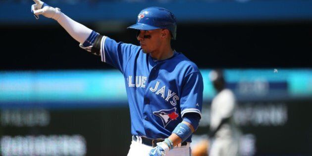 TORONTO, ON - AUGUST 16 - Blue Jays Ryan Goins after hitting a single during their baseball game as the Toronto Blue Jays take on the New York Yankees at Rogers Centre on August 16, 2015. Carlos Osorio/Toronto Star (Carlos Osorio/Toronto Star via Getty Images)