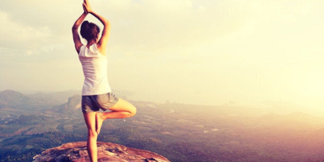 yoga woman mountain peak