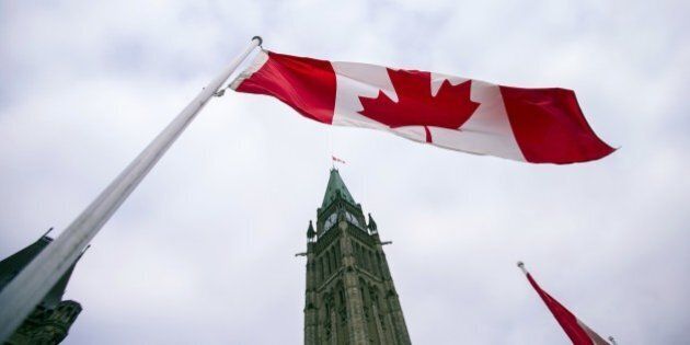A Canadian flag flies in front of the peace tower on Parliament Hill in Ottawa, Canada on December 4, 2015, as part of the ceremonies to the start Canada's 42nd parliament . AFP PHOTO/GEOFF ROBINS / AFP / GEOFF ROBINS (Photo credit should read GEOFF ROBINS/AFP/Getty Images)