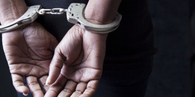 Black woman in handcuffs