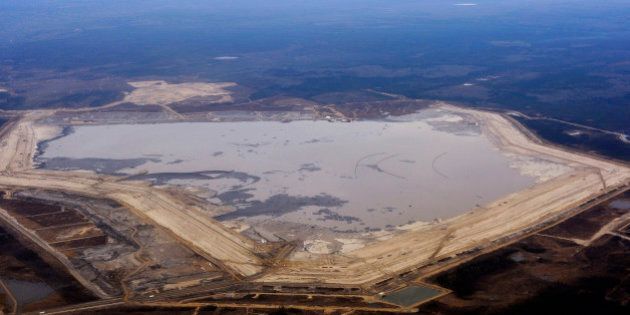 The Suncor tar sands tailings pond at their tar sands operation north of Fort McMurray, Alberta, November 3, 2011. A tailings pond holds all the toxic waste from oil sands extraction process. REUTERS/Todd Korol (CANADA - Tags: BUSINESS ENERGY)