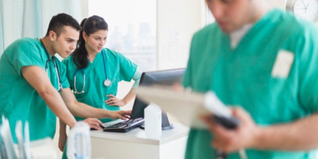 Hispanic nurses working in hospital