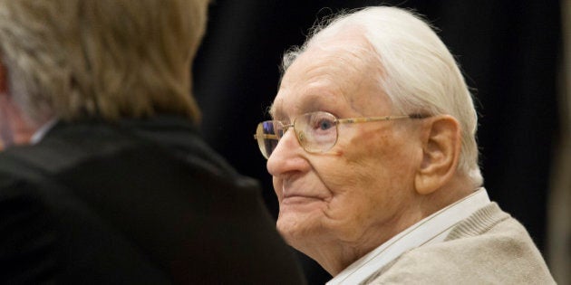 LUNEBURG, GERMANY - 21 APRIL: Oskar Groening, 93, arrives for the first day of his trial to face charges of being accomplice to the murder of 300,000 people at the Auschwitz concentration camp on April 21, 2015 in Lueneburg, Germany. Groening was an accountant with the Waffen SS and has been open about his role, claiming in interviews with media that he accepts his moral responsibility. Groening has also written an account of his experience, in what he claims is an effort to counter Holocaust revisionists. State prosecutors accuse Groening of accomplice in the murder of 300,000 Hungarian Jews who arrived at Auschwitz in 1944. (Photo by Andreas Tamme - Pool/Getty Images)