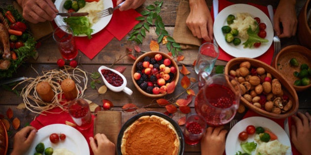 High angle view of festive table and people eating