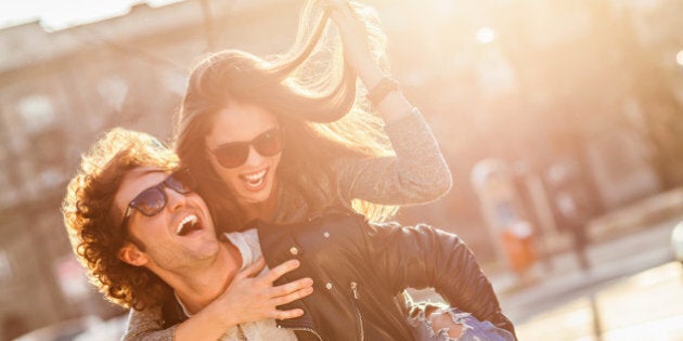 Close up of a happy young couple enjoying city life.