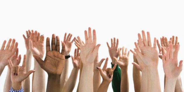 A large group of raised hands