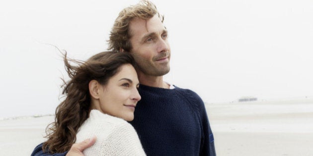 Couple hugging on the beach