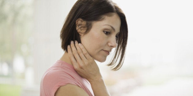 Pensive woman standing outdoors