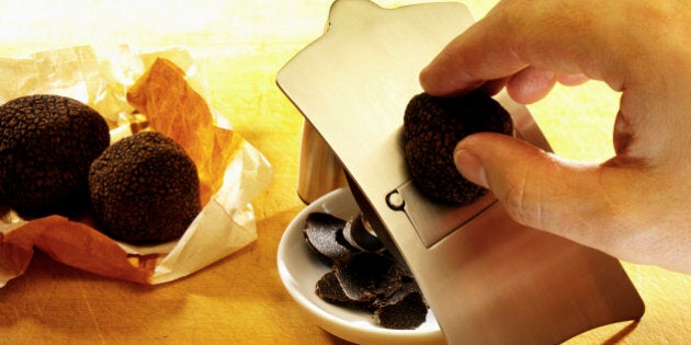 Black truffle being sliced