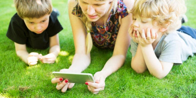 Family looking at phone