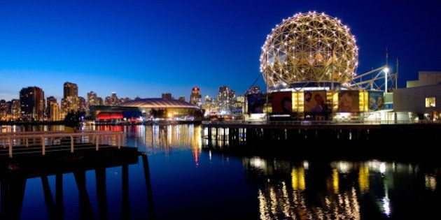 VANCOUVER, CANADA - FEBRUARY 18: The TELUS World of Science geodesic dome and the city skyline are reflected in the water February 18, 2009 in Vancouver, British Columbia, Canada. Vancouver is the host city for the 2010 Winter Olympic Games being held February 12-28, 2010. (Photo by Robert Giroux/Getty Images)