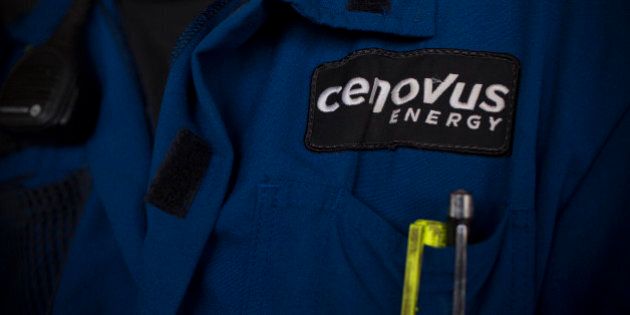 A Cenovus Energy Inc. logo is displayed on an employee's uniform at Christina Lake, a situ oil production facility half owned by Cenovus Energy Inc. and ConocoPhillips, in Conklin, Alberta, Canada, on Thursday, Aug. 15, 2013. Cenovus Energy Inc. is Canada's fourth-largest oil producer. Photographer: Brent Lewin/Bloomberg via Getty Images