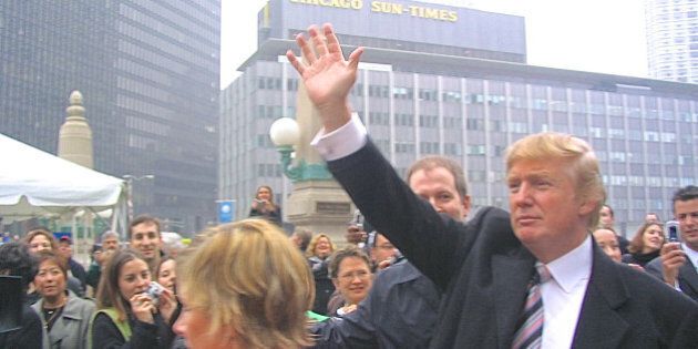 Chicago, IL, USA - October 28, 2004: An overcast afternoon view of real estate developer Donald Trump, from Wacker Drive across the Chicago River toward the old Sun-Times Building, greeting onlookers prior to a public demolition event of that structure, which would make way for construction of the Trump International Hotel and Tower on that site.