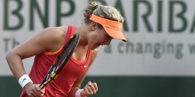 Canada's Eugenie Bouchard reacts during her French tennis Open third round match against Sweden's Johanna Larsson at the Roland Garros stadium in Paris on May 30, 2014. AFP PHOTO / DOMINIQUE FAGET (Photo credit should read DOMINIQUE FAGET/AFP/Getty Images)