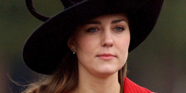 Prince William's girlfriend Kate Middleton arrives at the Sovereign's Parade at The Royal Military Academy in Camberley, west of London, 15 December 2006. Prince William was among the 446 officer cadets on parade, of which 227 passed out receiving their commision and becoming officers. Prince William is to join the Household Cavalry in The Blues and Royals. (Photo credit should read BEN GURR/AFP/GettyImages)