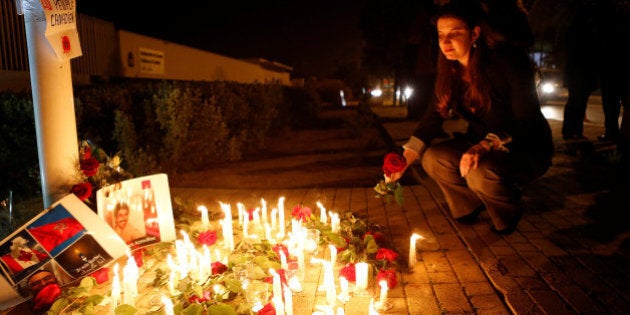 Nathalie Dube, Canada's ambassador to Morocco, lays flowers at a memorial in front of the Embassy of Canada in Rabat February 6, 2017, during a tribute to victims killed at a Quebec City mosque. REUTERS/Youssef Boudlal