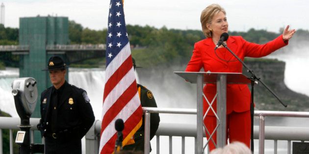 U.S. Secretary of State Hillary Rodham Clinton speaks in the center of the Rainbow Bridge which connects the USA with Canada at Niagara Falls, N.Y. on Saturday June 13, 2009. In brief remarks in Canada, Clinton cited