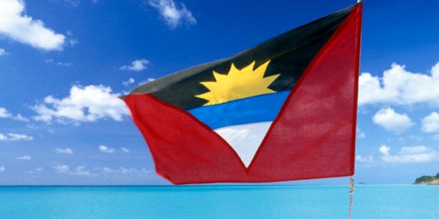 Antigua and Barbuda, Antigua Island, the national flag in red, white, blue and black, with the symbol of the rising sun in the middle