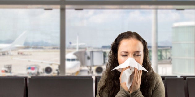 sneezing woman sick blowing nose with white background