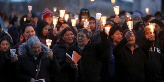 People take part in a march and candlelight vigil in the Attawapiskat First Nation in northern Ontario, Canada, April 15, 2016. REUTERS/Chris Wattie