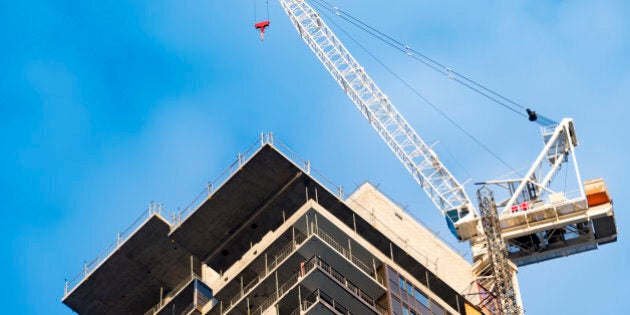 TORONTO, ONTARIO, CANADA - 2016/05/28: Contruction boom in real estate market. The housing market is hot in Toronto provoking a construction boom in the city. Construction crane next to the building. (Photo by Roberto Machado Noa/LightRocket via Getty Images)