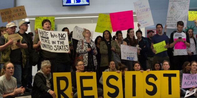 Protesters gather at the International Terminal Arrival Hall of San Francisco International Airport on January 29, 2017 against President Donald Trump's Muslim ban. (Photo by Yichuan Cao/NurPhoto via Getty Images)