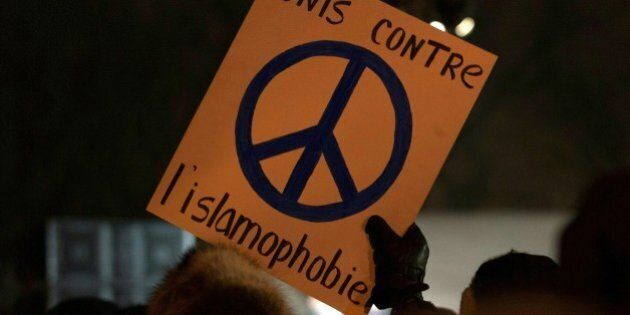 A person holds a sign 'United against Islamophobia' during a rally near the Islamic Cultural Center in Quebec City, Canada on January 30, 2017.Gunmen stormed into a Quebec mosque during evening prayers January 29 and opened fire on dozens of worshippers, killing six and wounding eight in what Canadian Prime Minister Justin Trudeau condemned as a 'terrorist attack.' Canadian police sought Monday to piece together the motive for a shooting attack, one of the worst attacks ever to target Muslims in a western country. / AFP / Alice Chiche (Photo credit should read ALICE CHICHE/AFP/Getty Images)