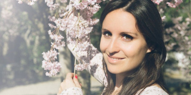 Beautiful woman with cherry blossoms in Japan