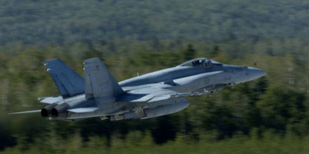 A CF-18 takes off from the Canadian Air Force base in Bagotville, Quebec. The Bagotville base is currently serving as Canada's ready base that can respond to terrorist threats and attacks throughout Canada in a matter of minutes with heavily equipped F-18's. (Photo by Lucas Oleniuk/Toronto Star via Getty Images)