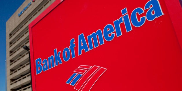 The Bank of America Corp. logo is displayed in front of a branch in Galveston, Texas, U.S., on Saturday, Oct. 1, 2011. Bank of America Corp. (BAC) should face fraud proceedings after its Countrywide unit submitted faulty data to back up claims for reimbursement on federally insured mortgages, according to an audit by a U.S. watchdog. Photographer: Scott Eells/Bloomberg via Getty Images