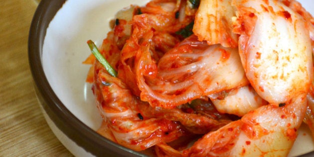 Close up cabbage kimchi on table.