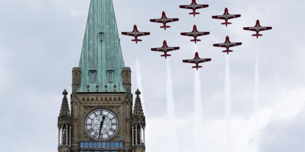 The Canadian Forces Snowbirds aerobatic team fly past the Peace Tower during Canada Day celebrations on Parliament Hill in Ottawa, Ontario, Canada, July 1, 2016. REUTERS/Chris Wattie
