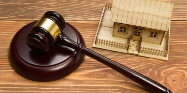 Auction. Law. Miniature House on wooden table and Court Gavel.